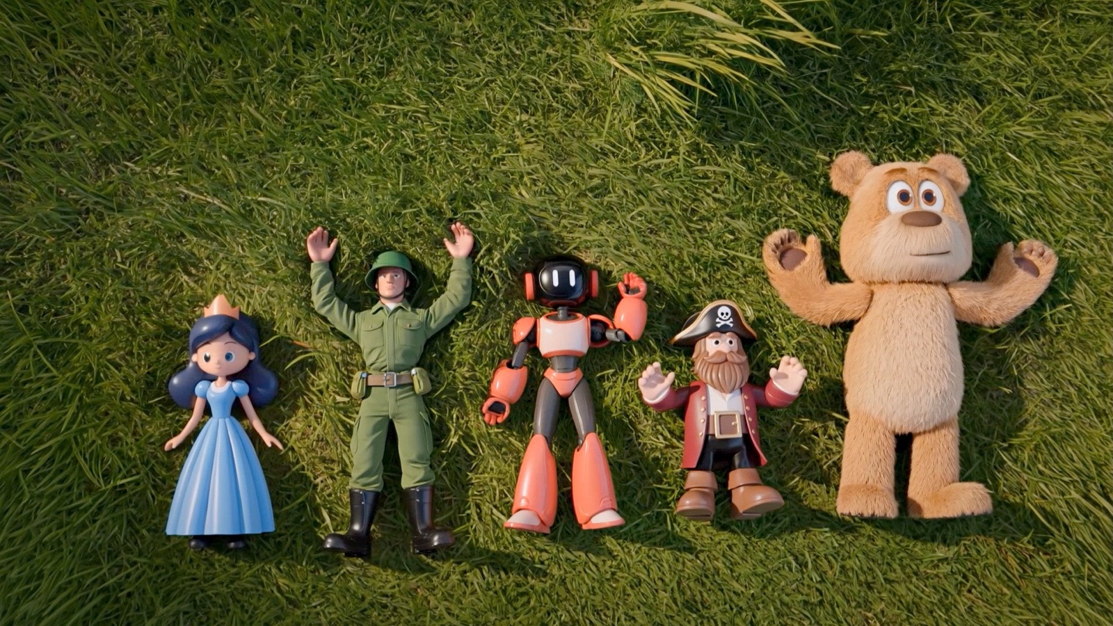 The five toy heroes lie together in the grass.